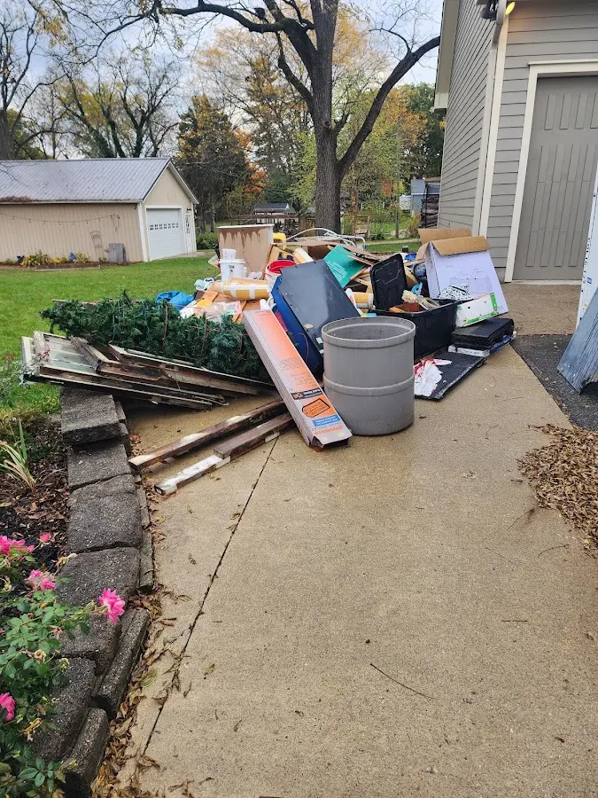 Dumpster being loaded with debris for Demolition Dumpster Rental in Wyldwood